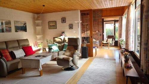 Wohnzimmer mit Schiebetür zum Kaminzimmer - 