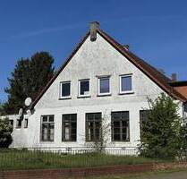 Syke-Okel: große Erdgeschoss-Wohnung mit Sanierungsbedarf