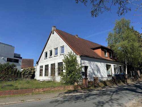 Straßenansicht - 4 Zimmer Etagenwohnung zum Kaufen in Syke-Okel