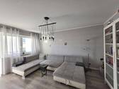 Wohnzimmer - Charmante 3-Zimmer-Wohnung mit Loggia & Garage in Schloß Neuhaus