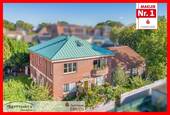Seitenansicht - 7 Zimmer Mehrfamilienhaus, Wohnhaus zum Kaufen in Emden