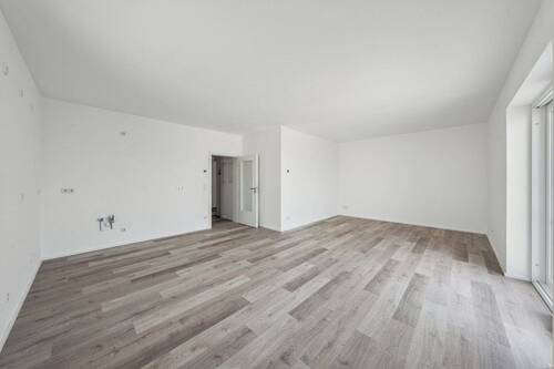 Wohnbereich - Blick auf die Küche - Zentrales Wohnen: 3 Raum Wohnung mit Balkon - Erstbezug - Weitere Einheiten verfügbar!