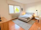 Schlafzimmer KI-visualisiert - Wohnung links - Etagenwohnung mit 74,00 m&sup2; in Heusenstamm zum Kaufen