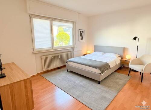 Schlafzimmer KI-visualisiert - Wohnung links - Etagenwohnung mit 74,00 m&sup2; in Heusenstamm zum Kaufen