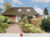 Haus zu verkaufen in Stuhr Varrel – H & T Immobilien - Stuhr - Varrel! - Familienhaus mit großem Garten und Doppelgarage!