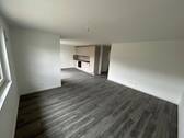 Wohnzimmer - Moderne 2-Zimmer-Neubauwohnung mit Terrasse, EBK & Stellplatz in Boxberg-Kupprichhausen