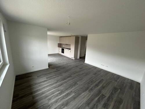 Wohnzimmer - Moderne 2-Zimmer-Neubauwohnung mit Terrasse, EBK & Stellplatz in Boxberg-Kupprichhausen