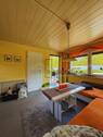 Wohnzimmer Richtung Schlafzimmer und Ein- und Ausgang - 