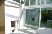 Wintergarten mit offenem Kamin - 