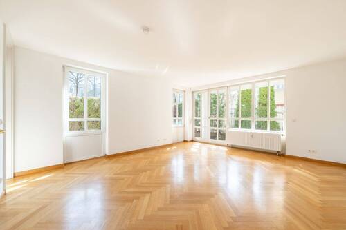 Wohnzimmer - AIGNER - Elegante Gartenwohnung mit Süd- West-Terrasse in Bestlage Harlaching