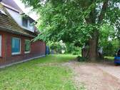 Gartenansicht - Mehrfamilienhaus, Wohnhaus in Wohltorf