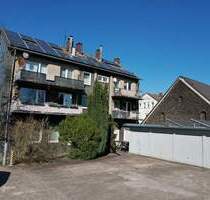 MEHRFAMILIENHAUS MIT GROßER GEWERBEFLÄCHE UND ACHT GARAGEN IN DORTMUND-EVING