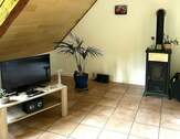 Wohnzimmer mit Ofen OG - 