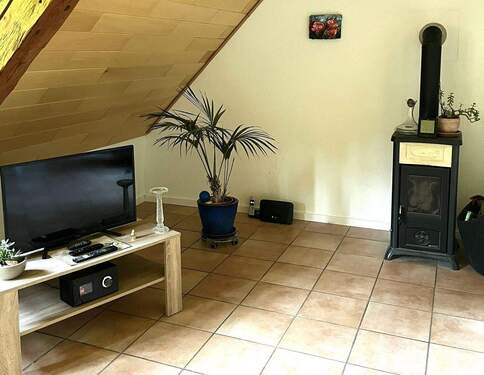 Wohnzimmer mit Ofen OG - 