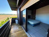 Schlafzimmer mit Balkonblick - 