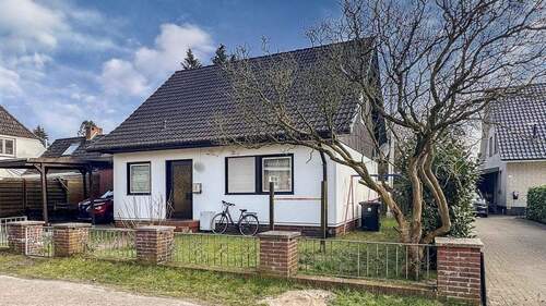 Ansicht - Gemütliches Einfamilienhaus mit solidem Mietertrag - Ihre Investition in eine sichere Zukunft