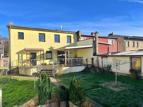 Das Haus aus Gartenansicht - Wohnen vor den Toren Rostocks: REH in Kessin nahe der Warnow, ca. 148 m² Wfl., 705 m² Grdst!