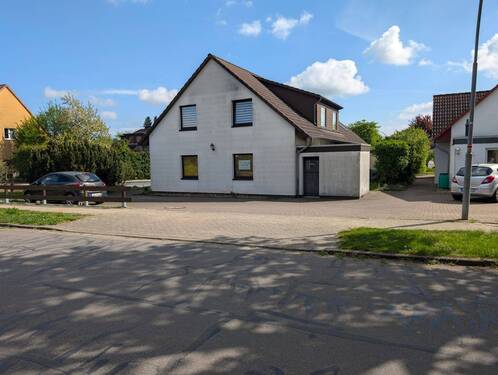  Seitenansicht - 1 Zimmer Mehrfamilienhaus, Wohnhaus zum Kaufen in Leiferde