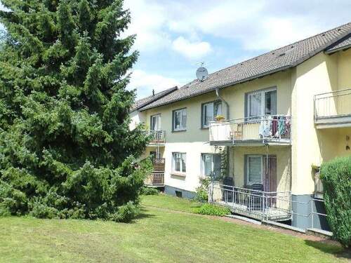 Rückseite Wohnhaus - Langjährig vermietete 3-Zimmerwohnung in Burscheid mit Südbalkon!