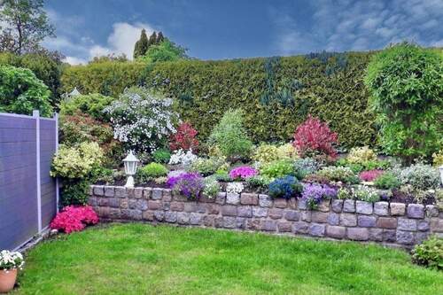 Garten im Sommer - Reihenmittelhaus mit 111,00 m&sup2; in Lübeck zum Kaufen