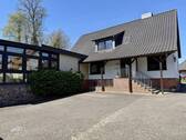 Rückwärtige Hausansicht mit Hof - links Wintergarten - Mehrfamilienhaus, Wohnhaus mit 180,00 m&sup2; in Bad Fallingbostel zum Kaufen