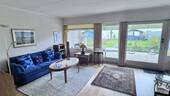 Wohnzimmer mit Blick in den Garten - 4 Zimmer Reihenmittelhaus in Flensburg