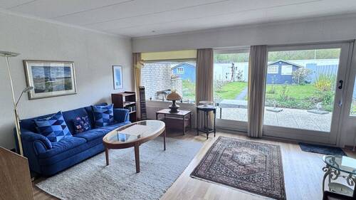 Wohnzimmer mit Blick in den Garten - 4 Zimmer Reihenmittelhaus in Flensburg