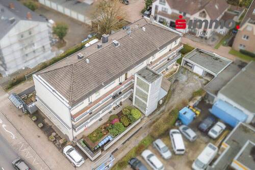 Titelbild mit Logo - Mehrfamilienhaus, Wohnhaus zum Kaufen in Herzogenrath