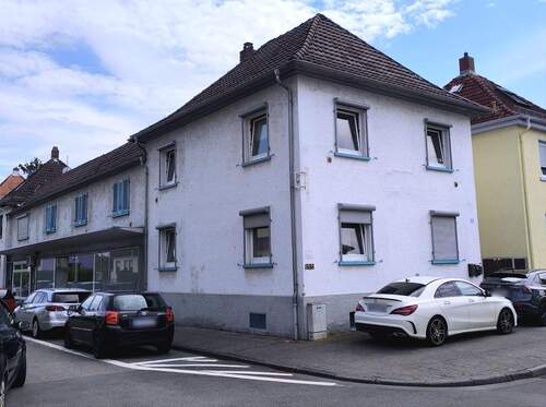Ansicht 1 - 8 Zimmer Mehrfamilienhaus, Wohnhaus zum Kaufen in Raunheim