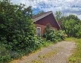 Auffahrt - Käuferprovisionsfrei: Renovierungsbedürftiges, ebenerdiges Einfamilienhaus mit separatem Baugrundstück in Neu-Börnsen zu verkaufen!