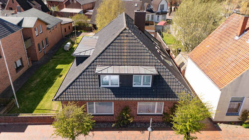 Luftbild - 1 Zimmer Mehrfamilienhaus, Wohnhaus in Lunden