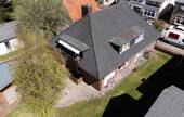 Luftbild - Mehrfamilienhaus, Wohnhaus mit 240,00 m&sup2; in Lunden zum Kaufen