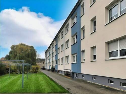 Ansicht Gebäuderückseite - 3 Zimmer Etagenwohnung in Krostitz