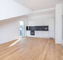 Bezugsfertig: Neubau-DG-Wohnung mit Balkon + EBK in Parsdorf bei München | KfW-40-QNG - WE 12