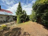 Ansicht und Garten - Einfamilienhaus mit 165,90 m² in Kitzingen zum Kaufen