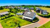 Wohnsiedlung in Eggermühlen - Einfamilienhaus mit 202,70 m&sup2; in Eggermühlen zum Kaufen