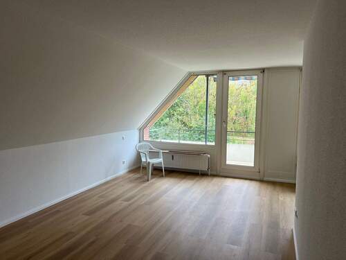 Wohnzimmer mit Balkon - 2 Zimmer Etagenwohnung in Ratekau