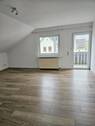 Wohnzimmer mit Balkon Wohnung DG - 