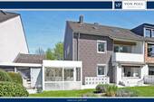Hausansicht Gartenseite - Attraktives Zweifamilienhaus mit großem Grundstück in ruhiger Wohnlage