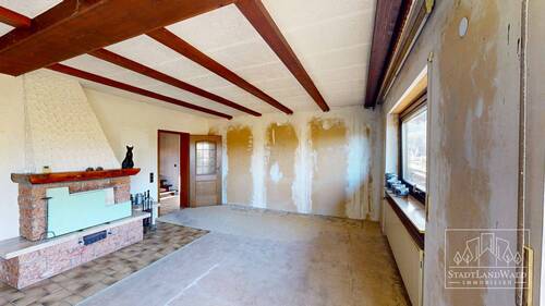 OG - Wohnzimmer mit offenem Kamin - 