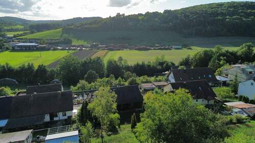 Gartenansicht - Mehrfamilienhaus, Wohnhaus mit 165,00 m² in Arnstein zum Kaufen