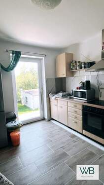 Küche Einliegerwohnung links - Energieeffizientes hochwertiges 3-Familienhaus in Neudorf-Platendorf