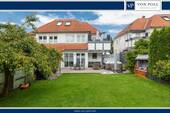 Gartenansicht - Klasse Terrasse mit Süd-Garten und Garage im beliebten Schüren