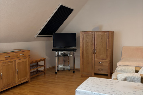 Der gemütliche Wohn- und Schlafbereich - 1 Zimmer Etagenwohnung in Putbus