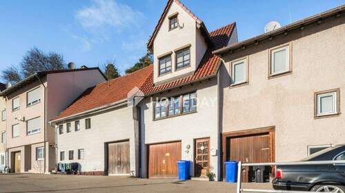 Außenansicht 2 - Gemütliches, kleines Reihenmittelhaus mit Garage, zwei Terrassen und zusätzlich Platz im DG