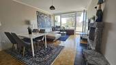 Wohnzimmer mit Blick zum Blk - Etagenwohnung mit 93,00 m² in Planegg zum Kaufen