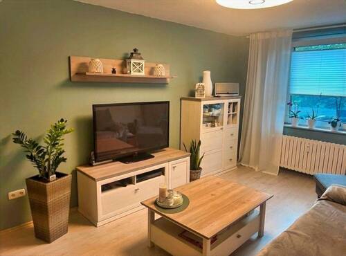 Wohnzimmer möbliert - Familienglück im EG mit eigener Terrasse