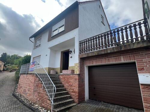 Hausansicht mit Garage - Einfamilienhaus mit 170,00 m² in Lauterecken zum Kaufen