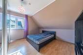 Das zweite Schlafzimmer im OG - 