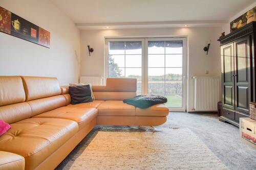 Wohnzimmer - 9 Zimmer Einfamilienhaus zum Kaufen in Vogelsang-Warsin